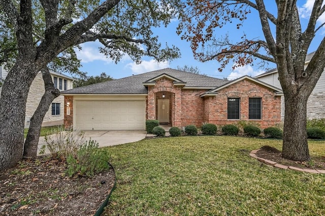 ranch-style home featuring a garage and a front yard