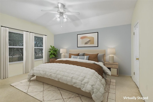 carpeted bedroom featuring vaulted ceiling and ceiling fan