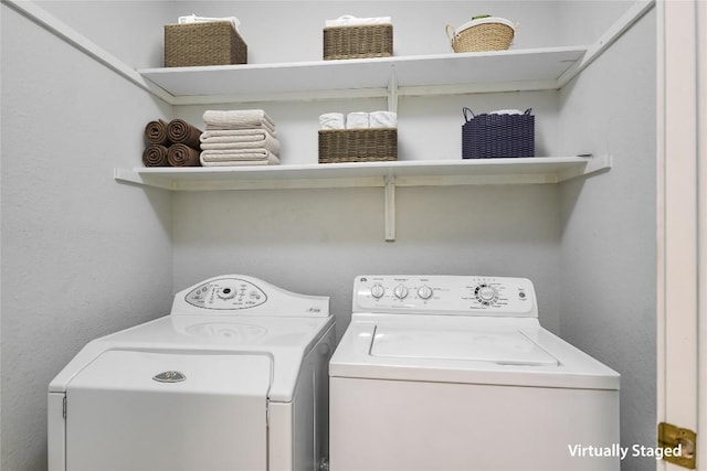 laundry room featuring washing machine and dryer