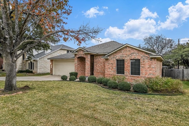 ranch-style house with a garage and a front yard