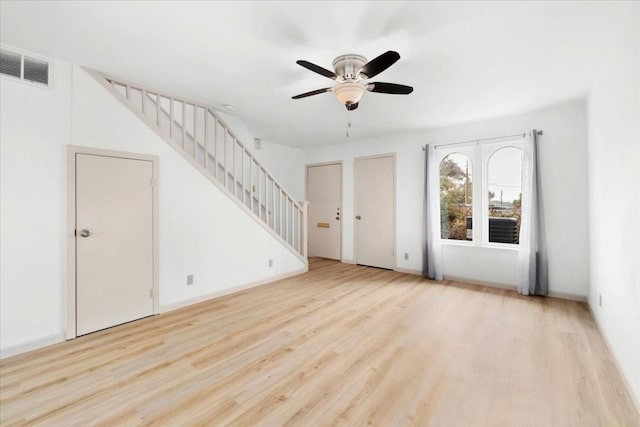 unfurnished living room featuring light hardwood / wood-style floors and ceiling fan