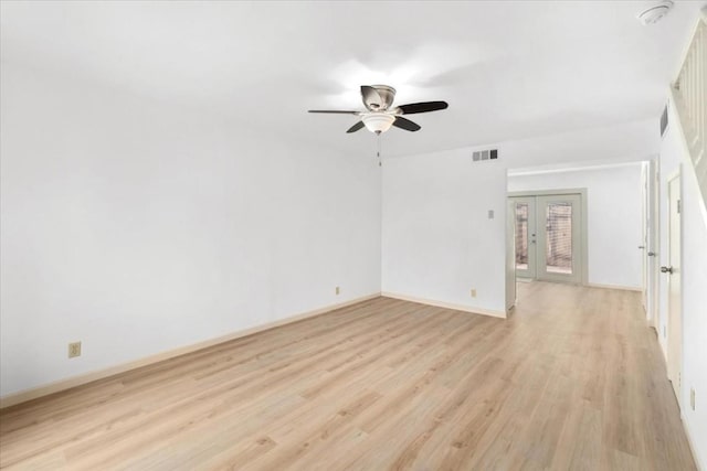 unfurnished room featuring light hardwood / wood-style floors, french doors, and ceiling fan