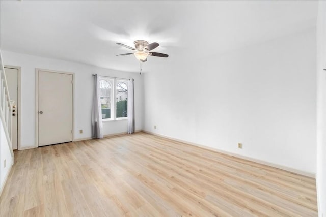 spare room featuring ceiling fan and light hardwood / wood-style flooring