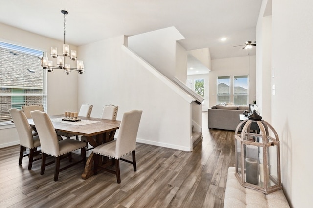 dining space featuring dark hardwood / wood-style floors and a chandelier