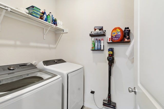 washroom with separate washer and dryer