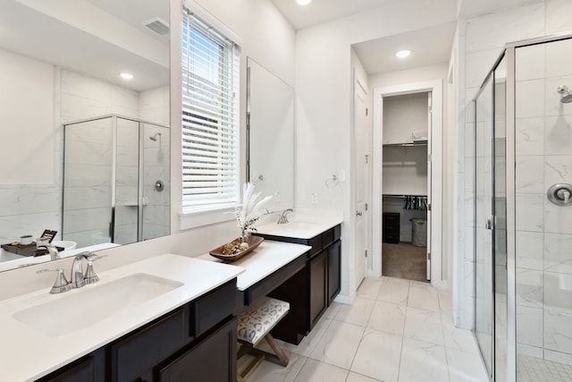 bathroom with vanity, a wealth of natural light, and an enclosed shower