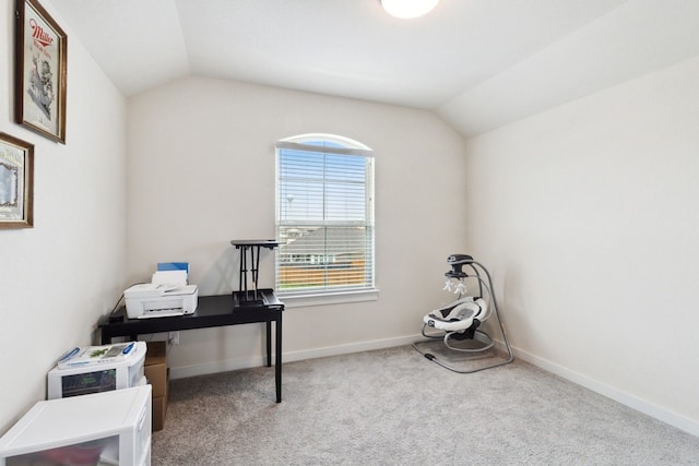 office area with lofted ceiling and light colored carpet