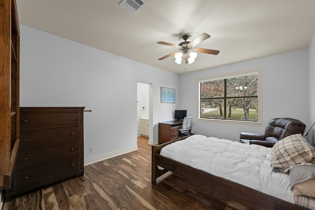 bedroom with dark hardwood / wood-style floors, ceiling fan, and ensuite bathroom