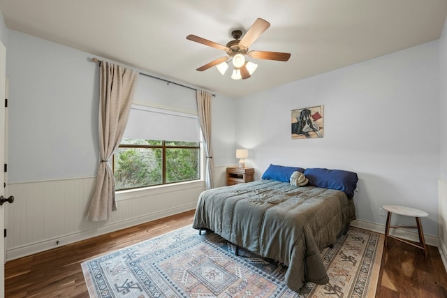 bedroom featuring dark hardwood / wood-style floors and ceiling fan