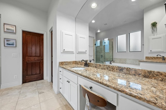 bathroom featuring vanity, an enclosed shower, and tile patterned flooring