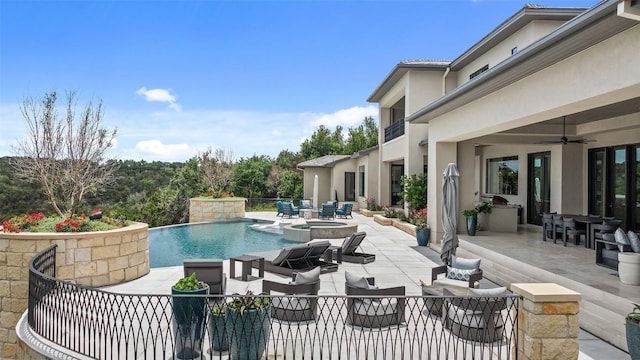 pool with an outdoor hangout area, a ceiling fan, outdoor dining area, and a patio