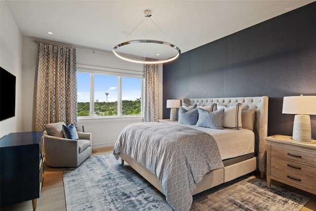 bedroom featuring recessed lighting, baseboards, and wood finished floors