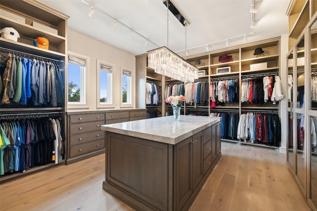 walk in closet featuring light wood-type flooring