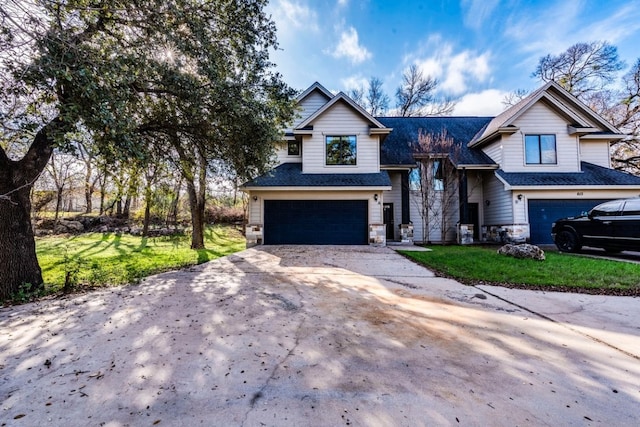 view of front of property featuring a garage and a front yard