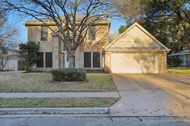 view of front of property featuring a garage and a front lawn