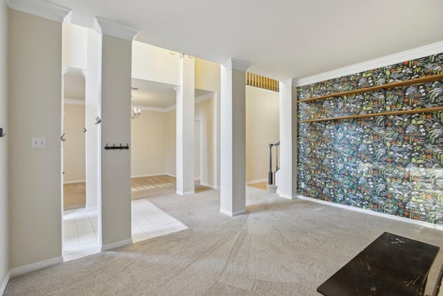 carpeted empty room with ornamental molding and a chandelier