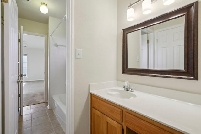 bathroom featuring tile patterned flooring, vanity, and shower / bath combination