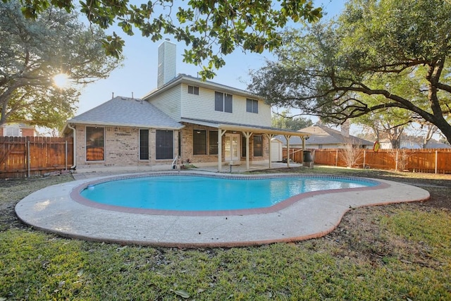 view of swimming pool with a patio