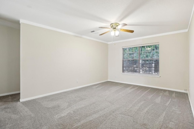 carpeted spare room with ornamental molding and ceiling fan