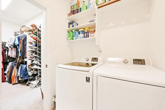 clothes washing area with washer and dryer and carpet flooring