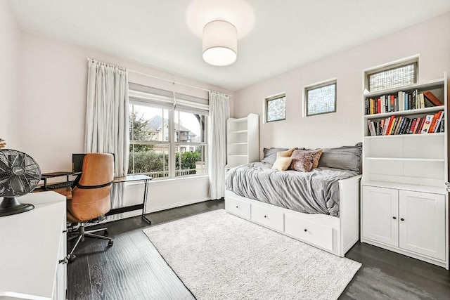 bedroom featuring dark hardwood / wood-style flooring