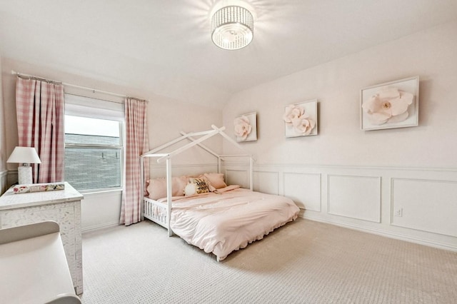 carpeted bedroom with vaulted ceiling