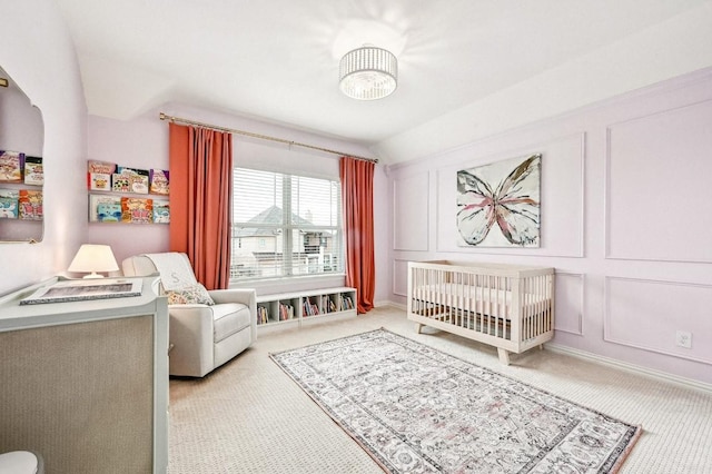 carpeted bedroom with a crib