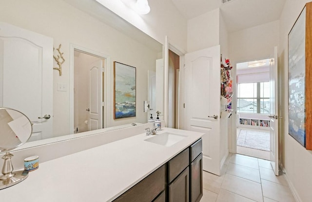 bathroom featuring tile patterned flooring and vanity