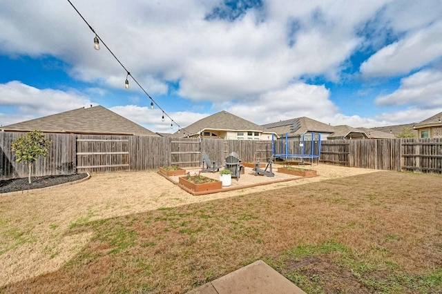 view of yard featuring a trampoline