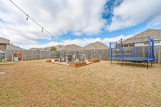 view of yard featuring a trampoline