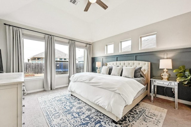 bedroom with lofted ceiling, light carpet, and ceiling fan