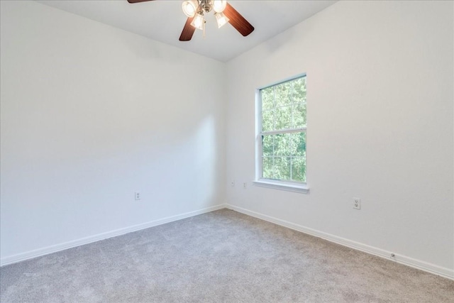 empty room featuring light carpet and ceiling fan