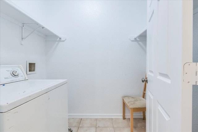 washroom featuring washer / clothes dryer and light tile patterned flooring