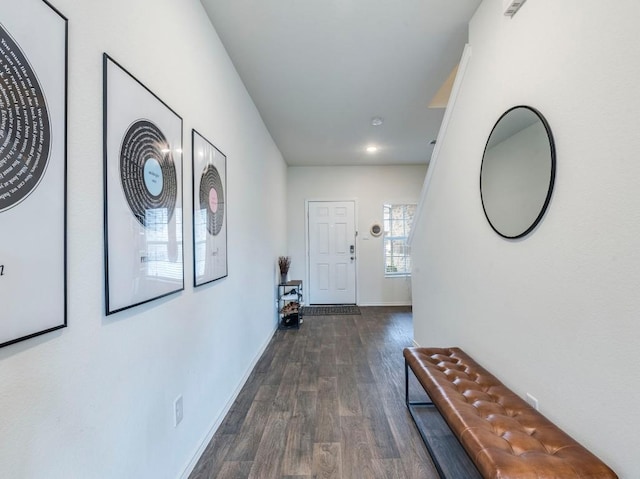 hallway with dark hardwood / wood-style flooring