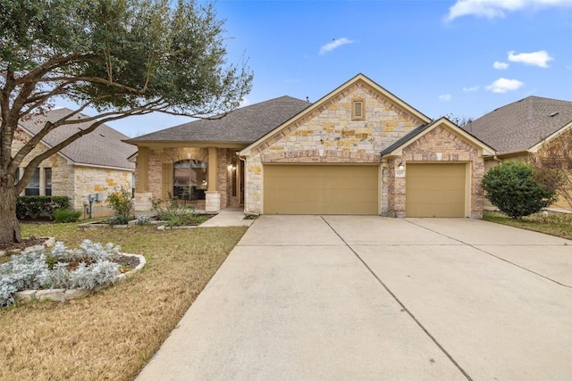 view of front of house with a garage and a front lawn