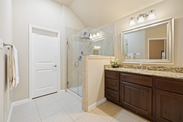 bathroom with tile patterned floors, vanity, a shower with door, and lofted ceiling