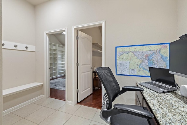 office space with light tile patterned floors