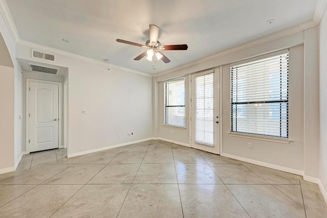 tiled spare room featuring crown molding and ceiling fan