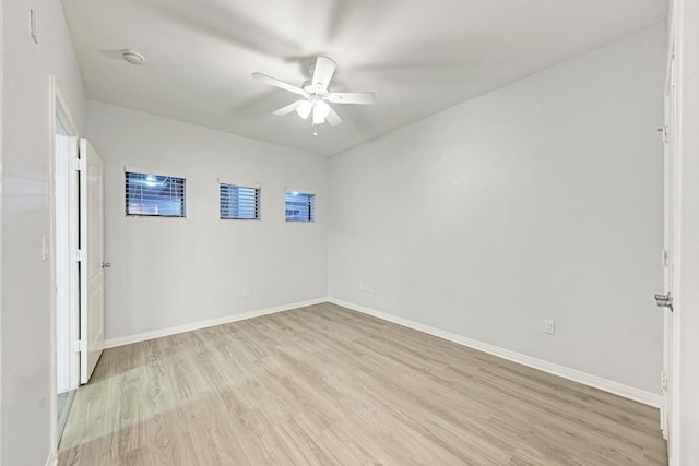 spare room featuring ceiling fan and light hardwood / wood-style floors