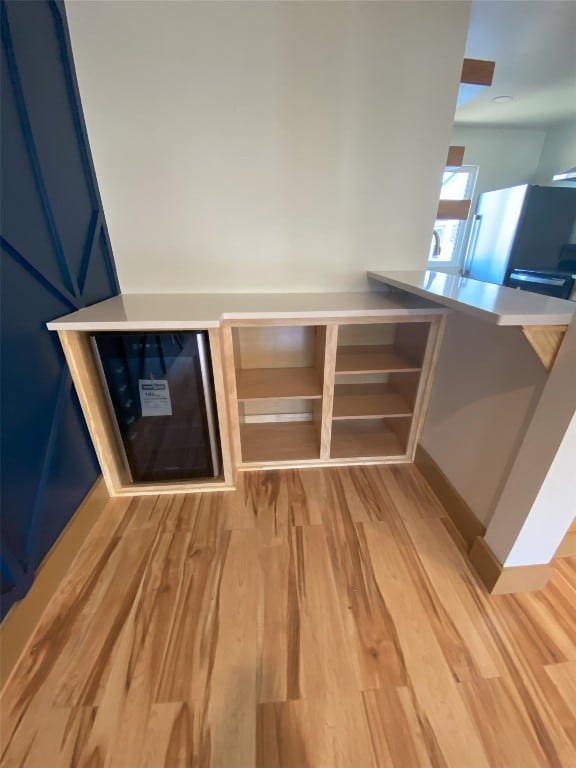 5801 Thunderbird St Unit A15, Lago Vista, TX 78645 - kitchen view of light wood finished floors and blue cabinetry