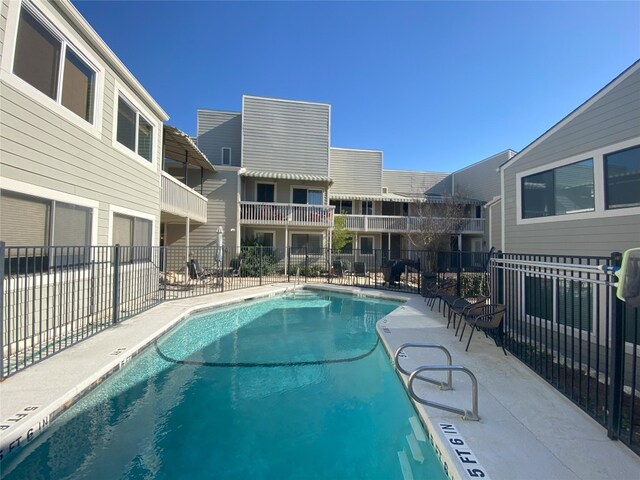 5801 Thunderbird St Unit A15, Lago Vista, TX 78645 - community pool featuring a patio area
