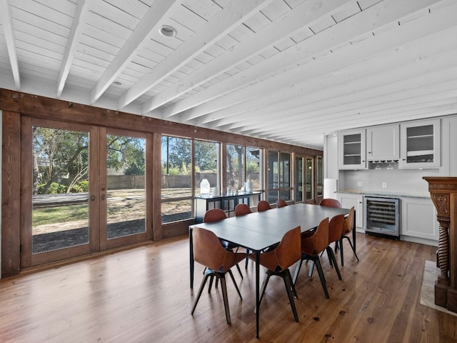 sunroom with wine cooler, wooden ceiling, and beamed ceiling