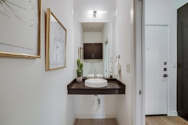 3600 S Lamar Blvd Unit 115, Austin, TX 78704 - bathroom featuring wood finished floors and baseboards