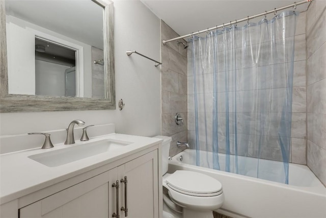 full bathroom featuring toilet, vanity, and shower / bath combo with shower curtain