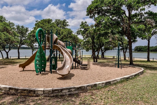 view of jungle gym featuring a water view