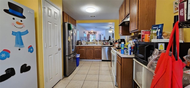 kitchen with sink, light tile patterned flooring, ceiling fan, and appliances with stainless steel finishes