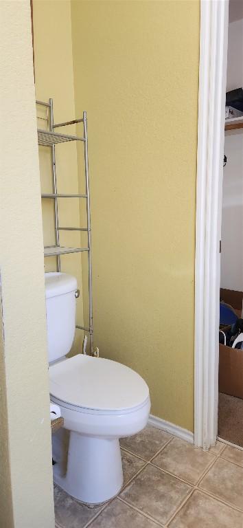 bathroom featuring tile patterned floors and toilet