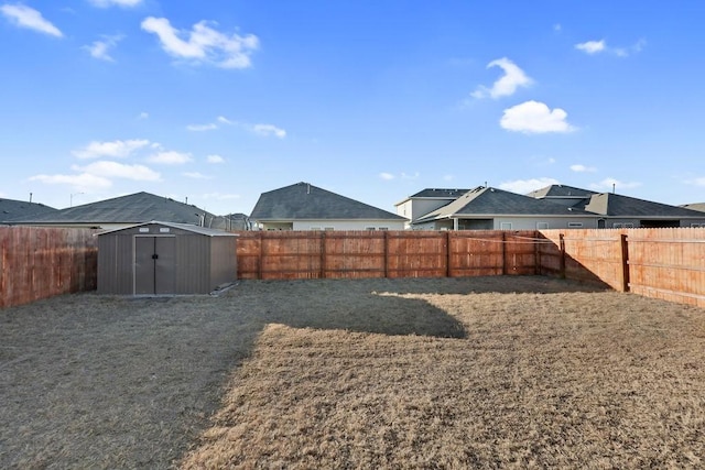 view of yard featuring a storage unit