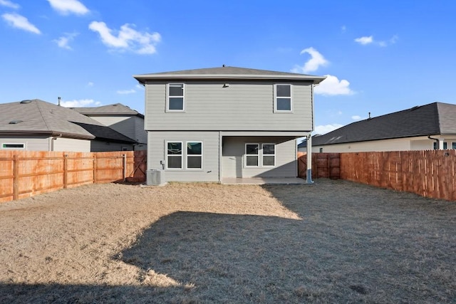 back of property featuring a patio and central air condition unit