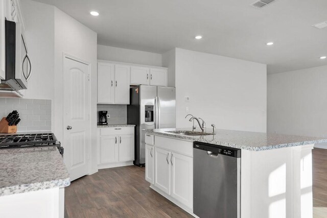 kitchen featuring sink, white cabinetry, stainless steel appliances, an island with sink, and dark hardwood / wood-style flooring